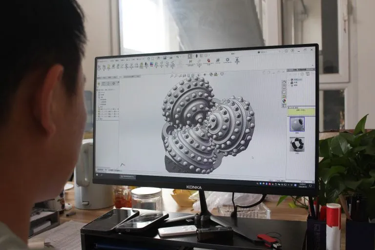 Engineer reviewing a drilling tool CAD model